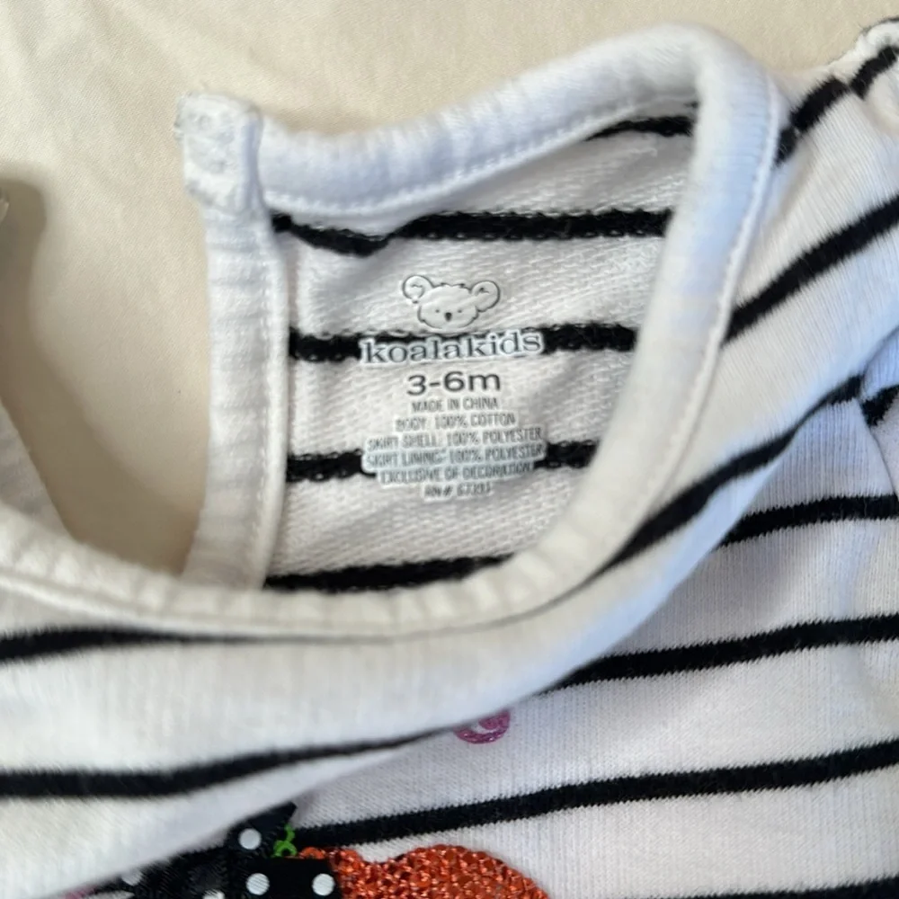 Bundle of my first Halloween clothes. Two long sleeve onesies and a tutu shirt.